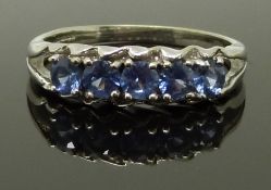 A 9ct white gold ring set with sapphires, size N, 3.70g