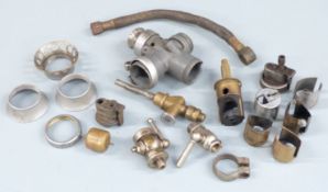 Quantity of pre war Amal motorcycle carburettor parts including body, slides, float and fuel taps