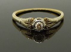 An 18ct gold ring set with a diamond in a platinum setting, size P, 2.21g