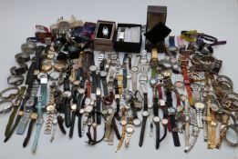 A large collection of various ladies and gentleman's wristwatches, some in original boxes.