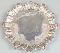 George V hallmarked silver salver with shaped edge, raised on three feet, Sheffield 1912 maker Atkin