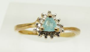 A 9ct gold ring set with a trilliant cut topaz and diamonds, 1.7g, size M