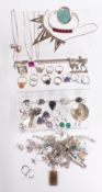 A collection of silver jewellery including snake ring, other rings, necklaces, bangle and earrings