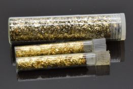 Three containers of gold filings, weight with containers 17.9g