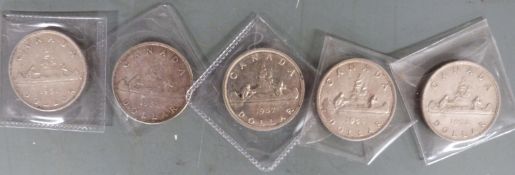 Five Canadian silver dollars, 1951, 1952, 1953, 1957 and 1959