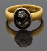 Victorian section of mourning ring set with black enamel and seed pearls in the form of a flower,