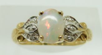 A 9ct gold ring set with an oval opal cabochon and diamonds, 2.4g, size N