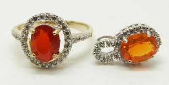 A 9ct gold ring set with an oval cut fire opal and a 9ct white gold pendant set with an oval cut