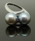 A 14k white gold ring set with two silver pearls, size L, 3.37g