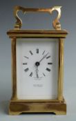 Martin and Co, Cheltenham 20thC brass carriage clock in corniche style case, the painted white Roman