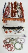 An amber necklace, carnelian necklace, sodalite, coral, French jet, etc