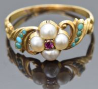 Victorian 18ct gold ring set with a ruby surrounded by split pearls and turquoise to the scrolling