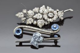 Two silver brooches, one set with foiled paste the other with paste and marcasite, and a Kenart