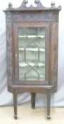 Carved Georgian oak glazed corner cupboard on stand, height 181cm