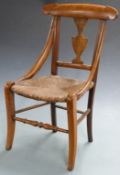 A 19thC child's or apprentice fruitwood chair, height 58cm