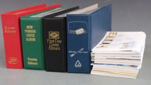 Four albums of GB first day covers together with loose covers