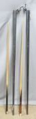 Two cased snooker or pool cues, one 