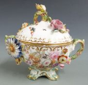 A 19thC Coalbrookdale sucrier with applied flower decoration, H 12cm