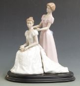 Nadal figural pair of a bride and bridesmaid, on plinth, H 37cm