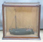 Model boat in glazed case, width 41cm