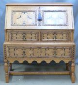 Oak Arts and Crafts style bureau with inlaid decoration, W95 x D51 x H107cm