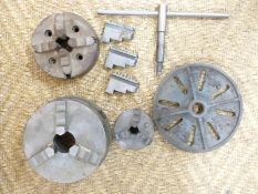 Three various lathe chucks, further jaws and a 9 inch faceplate