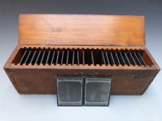 A case of twenty five glass photographic lantern slides each named 'The Woodbury Lantern Slide',