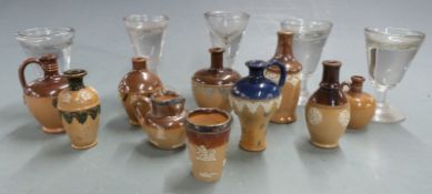 A collection of Royal Doulton miniatures and five glass penny licks