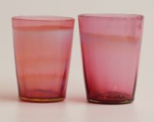 A pair of John Walsh for Powell Glass Company cranberry and blue opalescent glass tumblers, 8.5cm