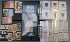 Two albums of cigarette cards including W.O & H.O Wills Arms of Public Schools and The Kings Art