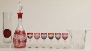 A flash overlaid and glass liqueur set comprising a decanter (36cm tall) and ix glasses all with cut