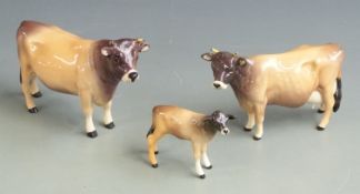 Beswick Jersey cattle, bull, cow and calf, tallest 12cm