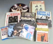 Approximately 40 DVDs some new and sealed plus 50 CDs and six metal signs