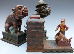 Three vintage novelty cast iron money boxes comprising 'Artillery Bank', 'Ole Puffer' and 'Bull