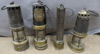 Four various miner's lamps, one by Ackroyd & Best and another G.T.Riches & Co. Ltd Orno, height of