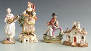 Staffordshire figure of boys fighting, pastille burner, Derby style figurine and a Meissen style
