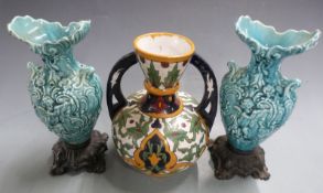 Turkish style twin handled vase impressed Etnao to base and two Majolica style vases, tallest 30cm