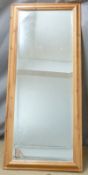 Bevelled edge pine framed mirror, overall size 134 x 58cm