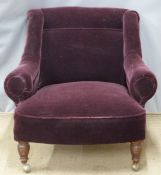 Upholstered armchair raised on turned front legs