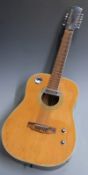 Twelve string acoustic guitar with fitted pick-up, in natural finish