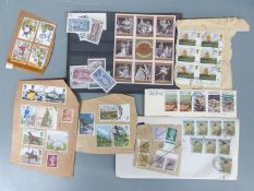 A large collection of all world stamps, loose and in envelopes
