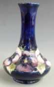 Moorcroft pedestal vase decorated in the pansy pattern, signed and impressed Moorcroft and 'by