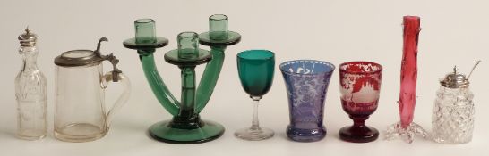 Eleven pieces of coloured glassware including a pair of flash overlaid amethyst vases with cut