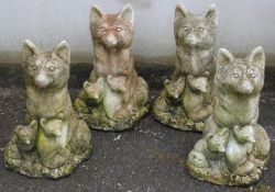 Four fox family garden ornaments, height 40cm