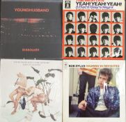 Approximately 90 albums including The Beatles and Bob Dylan