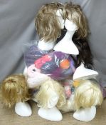 Three bags of yarn/wool/fabric and a box of polystyrene mannequin heads