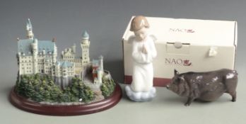 Lenox Great Castles of the World model 'Neuchwanstein', Doulton pig and a Nao figurine, tallest