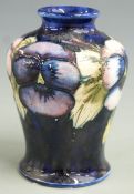 Moorcroft baluster vase decorated in the Pansy pattern, signed and impressed Moorcroft and 'by