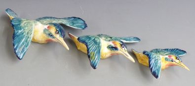 A set of three Beswick graduated kingfisher wall plaques, largest 21cm