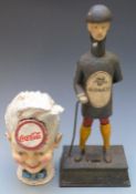 Two cast iron novelty advertising money boxes for Coca Cola and Guinness, tallest 34cm